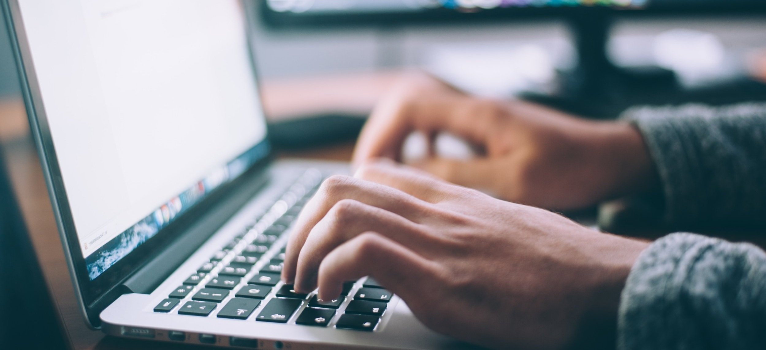 image of person typing on keyboard